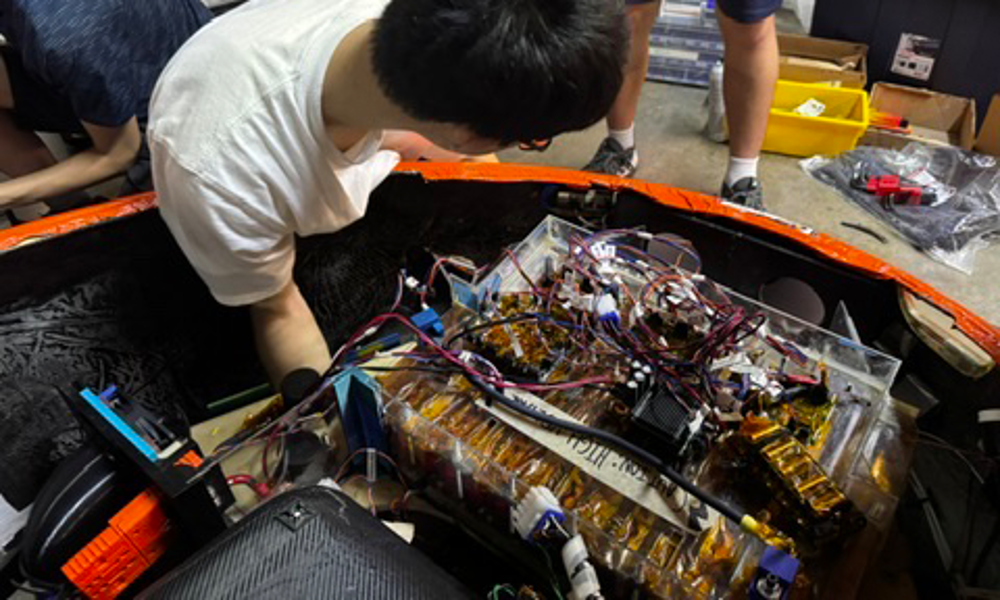 Illini Solar Engineering Team Wiring Calypso in Lab