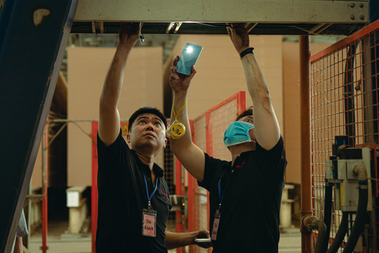 Our engineers are checking the cable system in the factory.