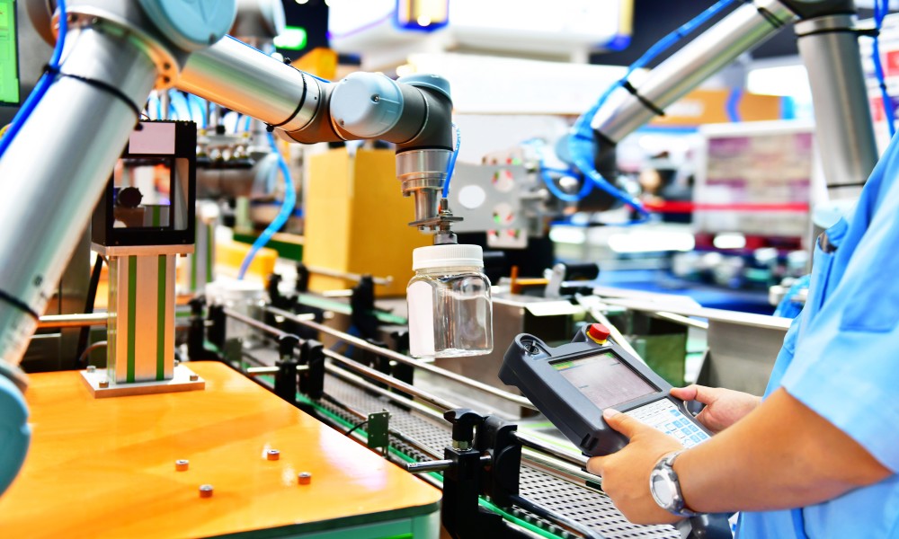 Engineer checks and controls automation robots