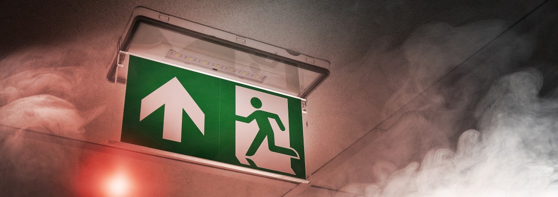 Emergy exit sign in dust