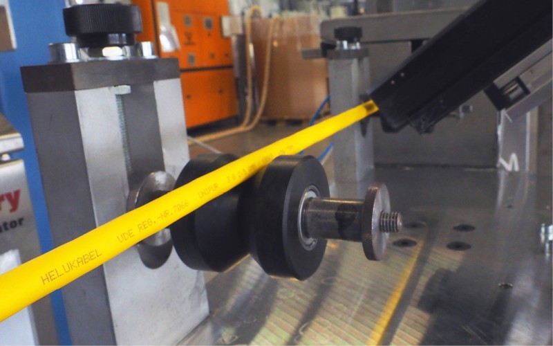 A yellow cable gets marked