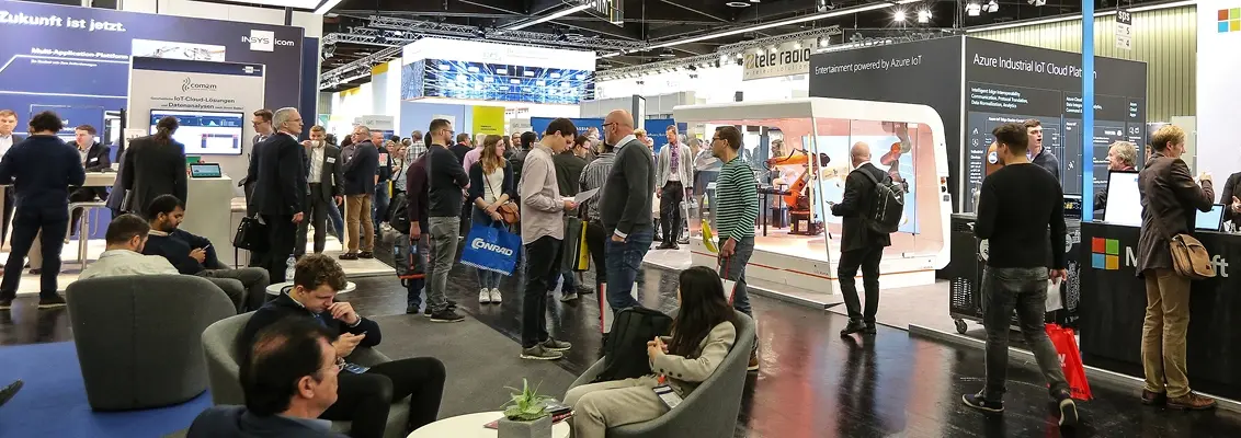 Exhibition stands with many people at the SPS fair