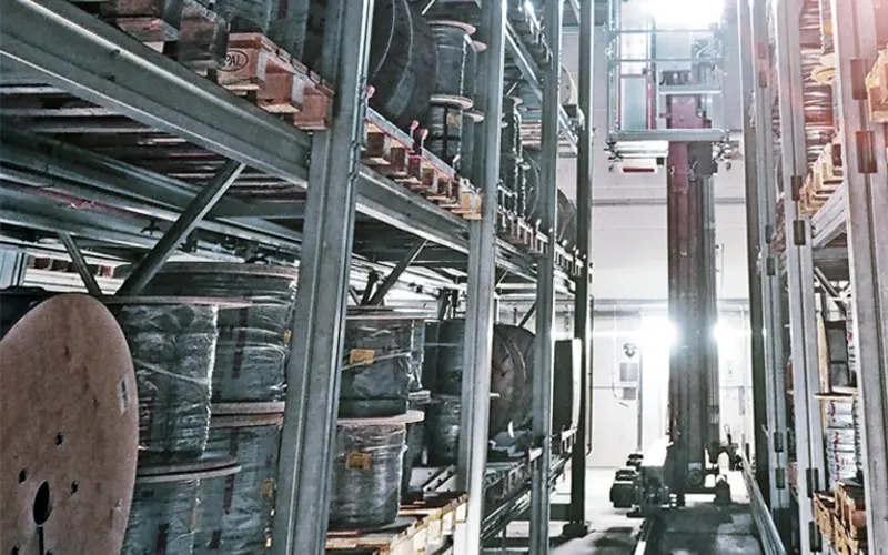 Man holding a tablet in a logistics warehouse