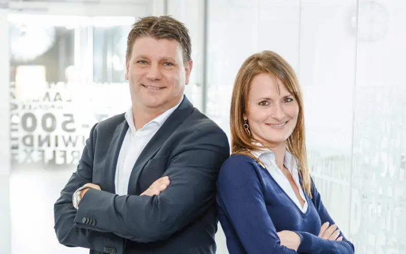 Günter Ehrentreich and Katja Türkyilmaz-Link standing back to back