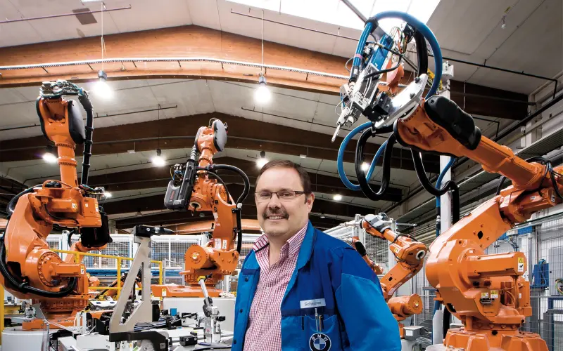 BMW production planner Manfred Scheuerer in production hall