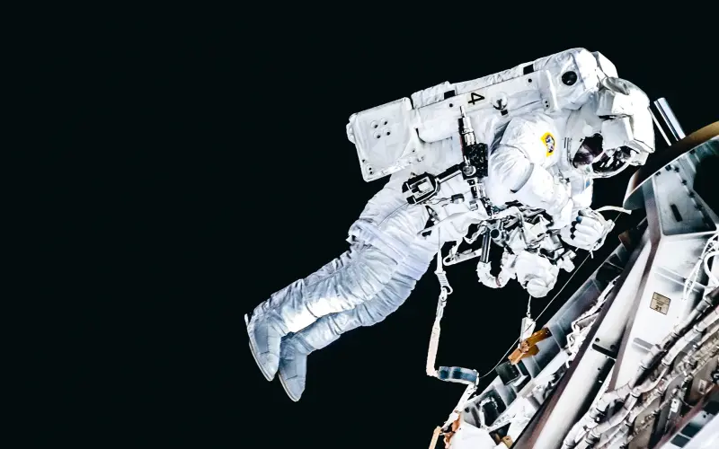 Astronaut flying next to a astro motor