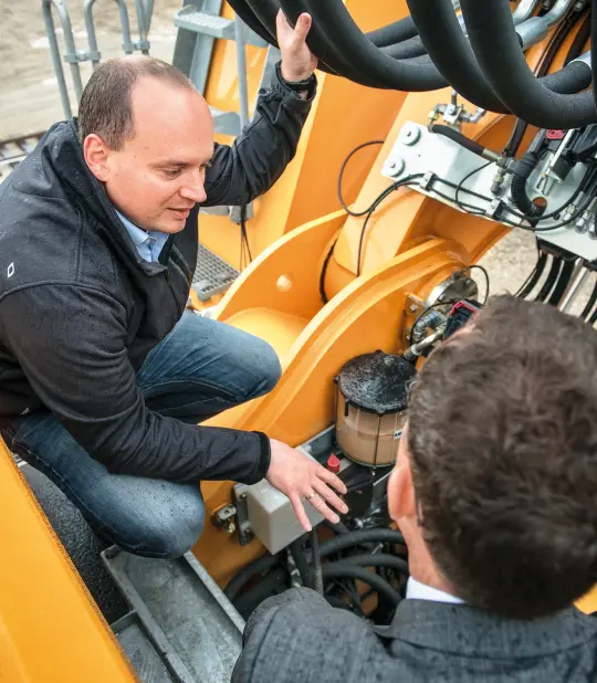 in conversation about the excavator