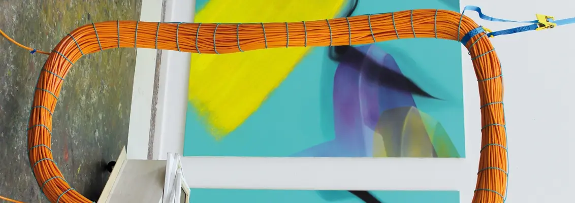 Packed orange cable hanging from the ceiling