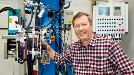 Martin Oster in front of a special machine